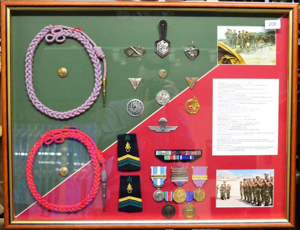 Lot 206 - French Foreign Legion, a framed display including fourrageres, photographs, medals, epaulettes...