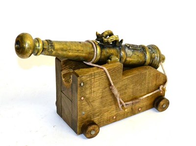 Lot 218 - A 19th Century Copy of a 17th Century Cannon, the 38cm brass barrel surmounted by two sinuous...