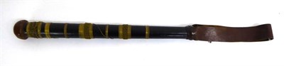 Lot 225 - A 19th Century South Asian Colonial Ebonised Truncheon, possibly Burmese, with leather covered...