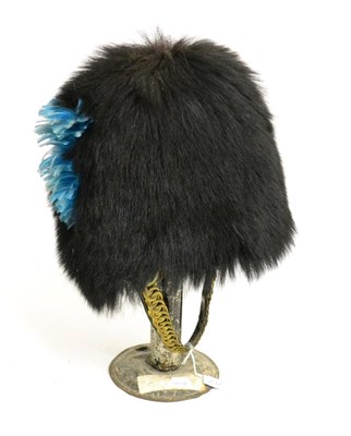 Lot 237 - An Irish Guards Black Bearskin Busby, with wicker frame, leather liner and leather backed brass...