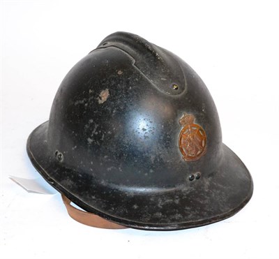 Lot 238 - A First World War Belgian Fireman's Helmet, with raised comb, bronzed badge, leather liner and...