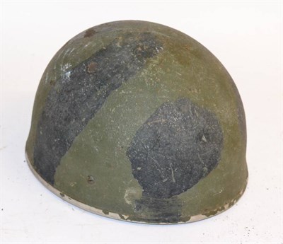 Lot 239 - A Paratrooper's Helmet, with camouflage paint, foam cushioned leather sweatband with webbing...