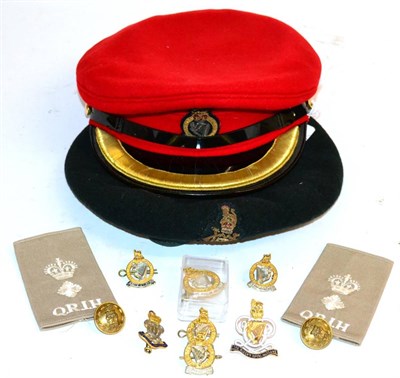 Lot 246 - The Queen's Royal Irish Hussars, an officer's scarlet wool peaked cap, with embroidered badge,...