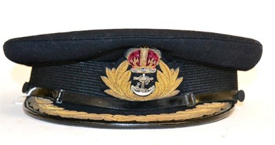 Lot 247 - A Second World War Naval Officer's Peaked Cap, in blue wool, with woven mohair centreband,...