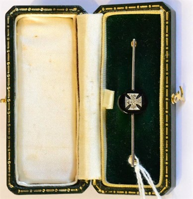 Lot 266 - A German Gold and Black Onyx Tie Pin, the oval onyx panel centred by an Imperial cross set with...