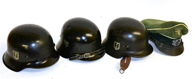 Lot 279 - German Third Reich: Three Various Reproduction Helmets and a Reproduction Officer's Visor Cap (4)