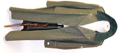 Lot 281 - A German Third Reich M35 Greatcoat, in field grey wool, double  breasted with bottle green lay down