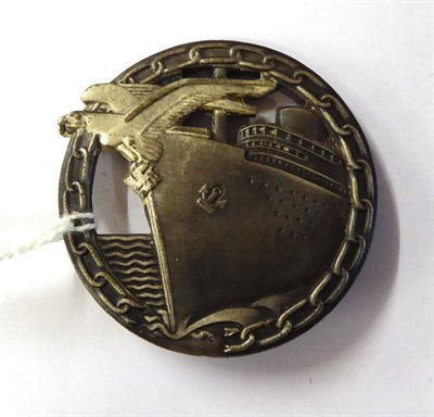 Lot 286 - A German Third Reich Blockade Runner's Badge and Stick Pin, the badge with vertical sword shape pin