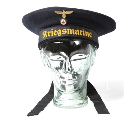 Lot 298 - A German Third Reich Sailor's ";Donald Duck"; Blue Wool Cap, the cap talley embroidered...