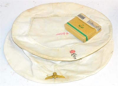 Lot 300 - Two German Third Reich Kriegsmarine White Cloth Cap Covers, one with gilt national eagle, the other