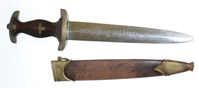 Lot 316 - A German Third Reich SA Dagger, the 21.5cm double edge steel blade etched Alles fur Deutschland and