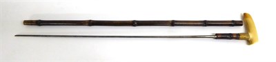 Lot 338 - A Victorian Bamboo Sword Stick, with 64.5cm fullered triangular  section steel blade, the gilt...