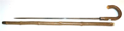 Lot 357 - A Cherry Wood Sword Stick by Swaine-Brigg, London, the 63cm single edge fullered steel blade etched