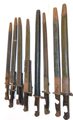 Lot 369 - Four British 1907 SMLE Pattern Bayonets, each with wood grip and steel mounted leather...