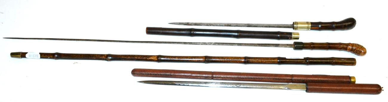 Lot 380 - An Edwardian Pigskin Swagger/Swordstick, the 34cm double edge steel blade etched with foliage...