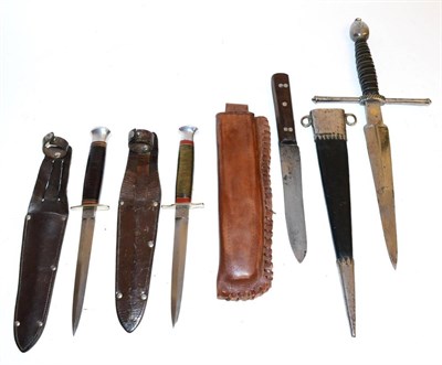 Lot 390 - Four Edged Weapons, comprising a small Bowie knife with steel rivetted wood grip and leather...