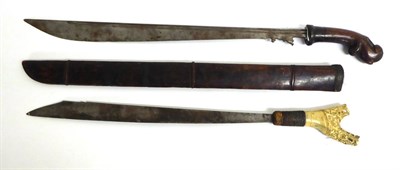 Lot 437 - A 19th Century Malayan Klewang, the 63cm single edge straight back curved steel blade, shaped...