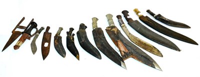 Lot 443 - Ten Various Kukris, eight with leather scabbards, one with wood scabbard, one lacking scabbard;...