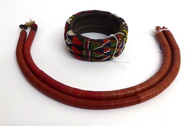 Lot 455 - An Early 20th Century Zulu Beadwork Bangle, made up of three coiled bands, each stitched with...