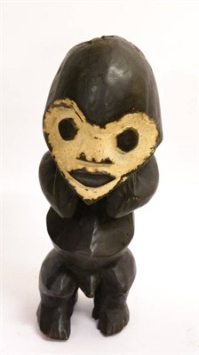 Lot 460 - A Mambila, Nigeria Ebonised Wood Ancestral Figure, the heart shape face with white...