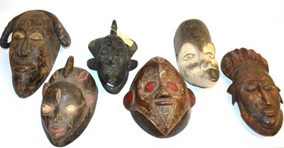 Lot 463 - A Collection of Six African Tribal Masks, comprising two Baule with combed coiffure and...