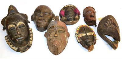 Lot 466 - A Collection of Seven African Tribal Masks, comprising a Bamileke with triple lobed and combed...