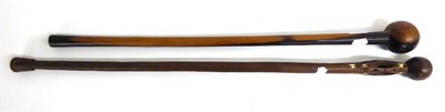 Lot 470 - A Zulu Knobkerrie, with small globular head, cylindrical haft and slightly swollen butt, 77cm;...