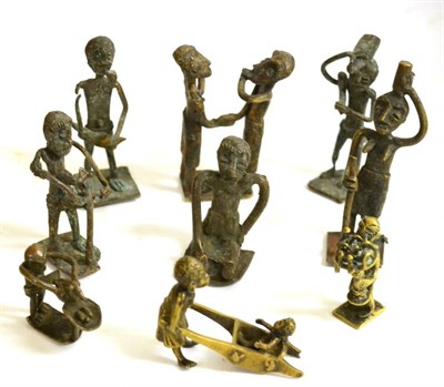 Lot 486 - A Collection of Eight Ashanti Brass Gold Weights, modelled as tribes people following their...