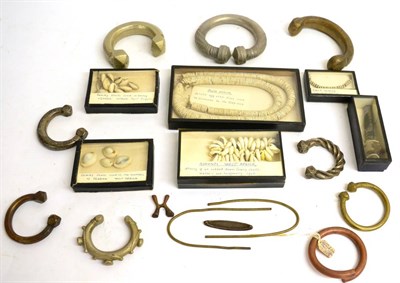 Lot 488 - A Collection of African Currency, including a small Baluba cross, copper ring bangle, two brass...