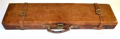 Lot 505 - A Leather Shotgun Case, the green baize lined interior fitted to take 30"; barrels, with gilt metal