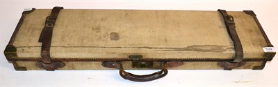 Lot 529 - A Leather Trimmed Canvas Shotgun Case, the maroon baize lined interior fitted to take 30"; barrels