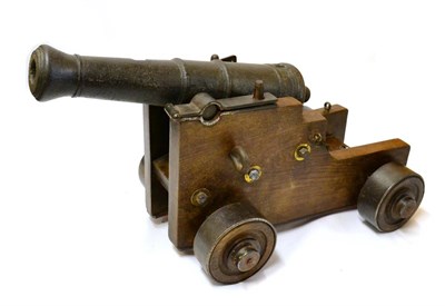 Lot 636 - An 18th Century Iron Signal Cannon, the three stage barrel with swamped muzzle, cylindrical...