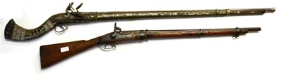 Lot 638 - A 19th Century Afghan Flintlock Jezail, the 110cm steel barrel with flared muzzle, rounded lock...