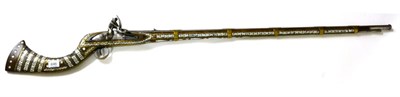 Lot 646 - A 19th Century Afghan Flintlock Jezail, the 107.5cm tapering rifled steel barrel chased at the...