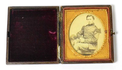 Lot 139 - A Rare U.S. Civil War Period Photograph of a U.S. Marine, seated three quarter length, wearing...