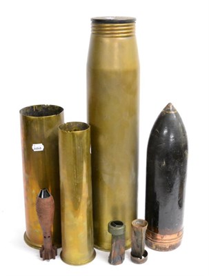 Lot 141 - Three Brass Artillery Shell Cases; a Wood Model of an Artillery Shell and a Canvas Drogue (5)