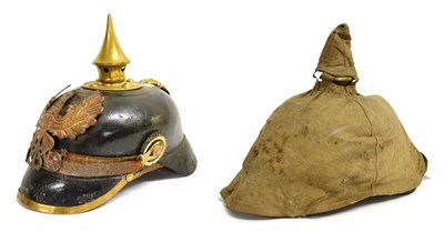 Lot 157 - An Imperial German Leather Pickelhaube, the brass spike with five ventilation holes, brass...