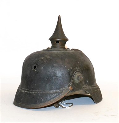 Lot 161 - A German Leather Pickelhaube, the brass spike with five ventilation holes, the spine with...