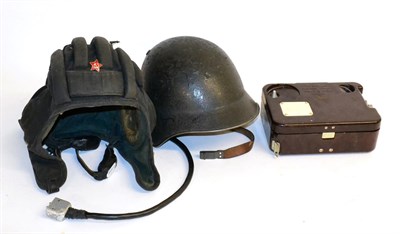 Lot 170 - Warsaw Pact Interest - an East German turtle combat helmet with cushioned leather liner and...