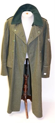 Lot 172 - A Second World War Swedish Greatcoat, in field grey wool, double  breasted with bottle green...