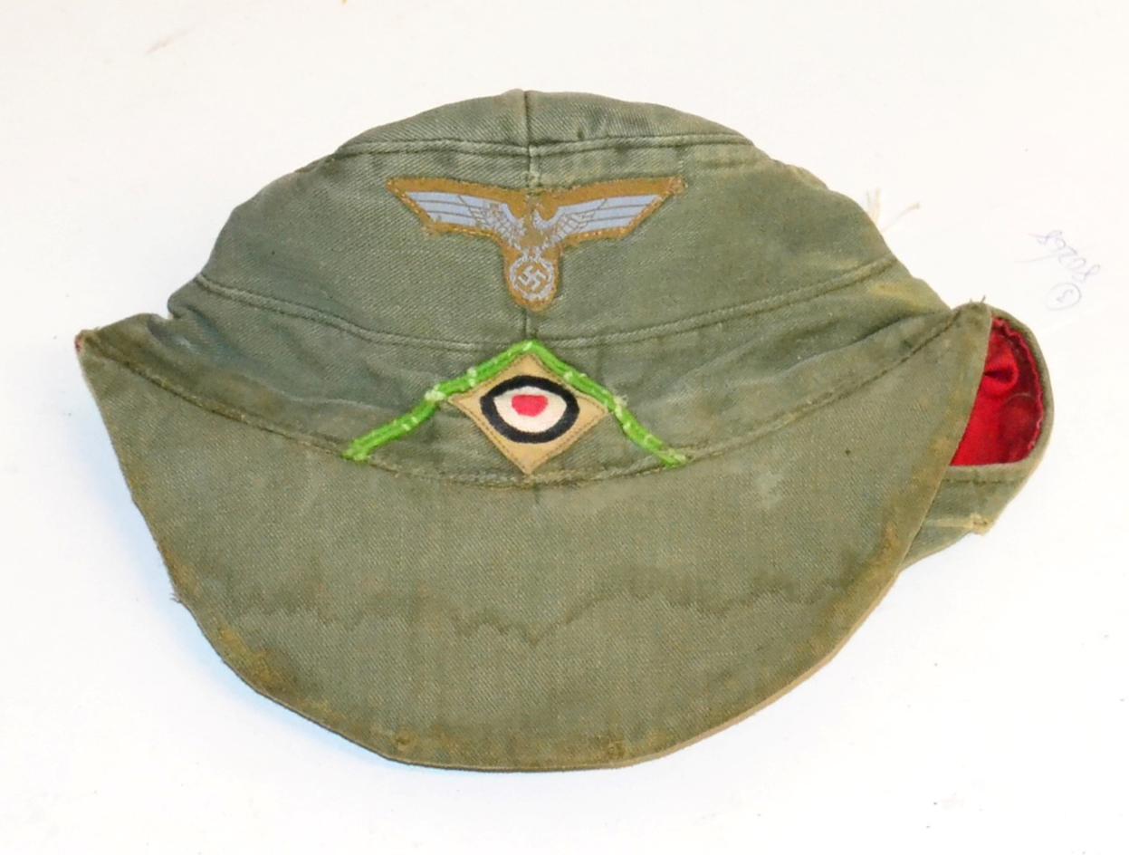 Lot 185 - A German Third Reich Afrika Korps Field Cap, of olive green twill, with two ventilation gromets...