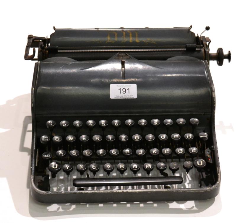 Lot 191 - A German Third Reich Portable Typewriter, finished in dark grey enamel, the paper rest with...