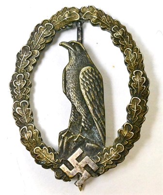 Lot 209 - A German Third Reich Luftwaffe Fliers Commemorative Badge, for retired aircrew, in white metal, the