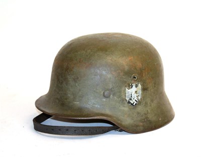 Lot 211 - A German Third Reich M35 Army Helmet, with traces of later single decal, the left inner brim...