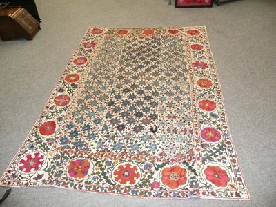 Lot 808 - Bukhara Susani The cream linen ground of six panels with a floral lattice field enclosed by borders