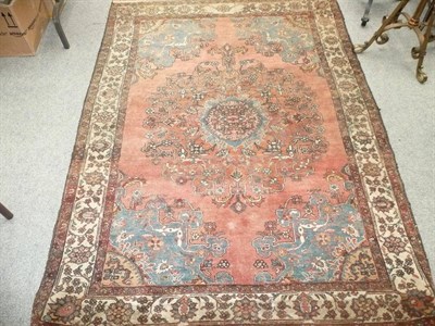 Lot 813 - Tafaish Rug Persian Kurdistan The salmon pink field centred by a large floral medallion framed...