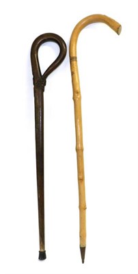 Lot 113 - Two First World War Period German Walking Sticks, one carved with an iron cross and oak leaves...