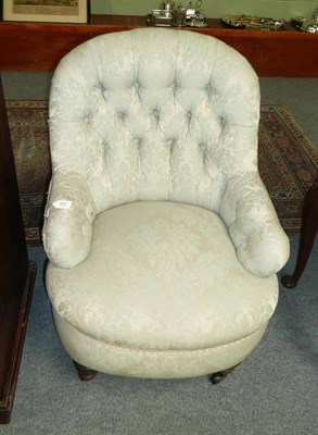 Lot 822 - A Late Victorian Tub Chair, late 19th century, upholstered in floral button back fabric, raised...