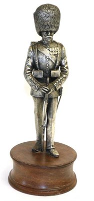 Lot 138 - A Cast Pewter Figure of a Coldstream Guardsman, by Michael Schofield, Sheffield, circular...