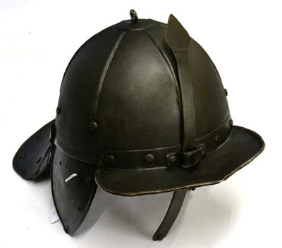 Lot 176 - A Cromwellian Lobster Tail Helmet, the one piece skull with six ribbed panels, adjustable nasal...